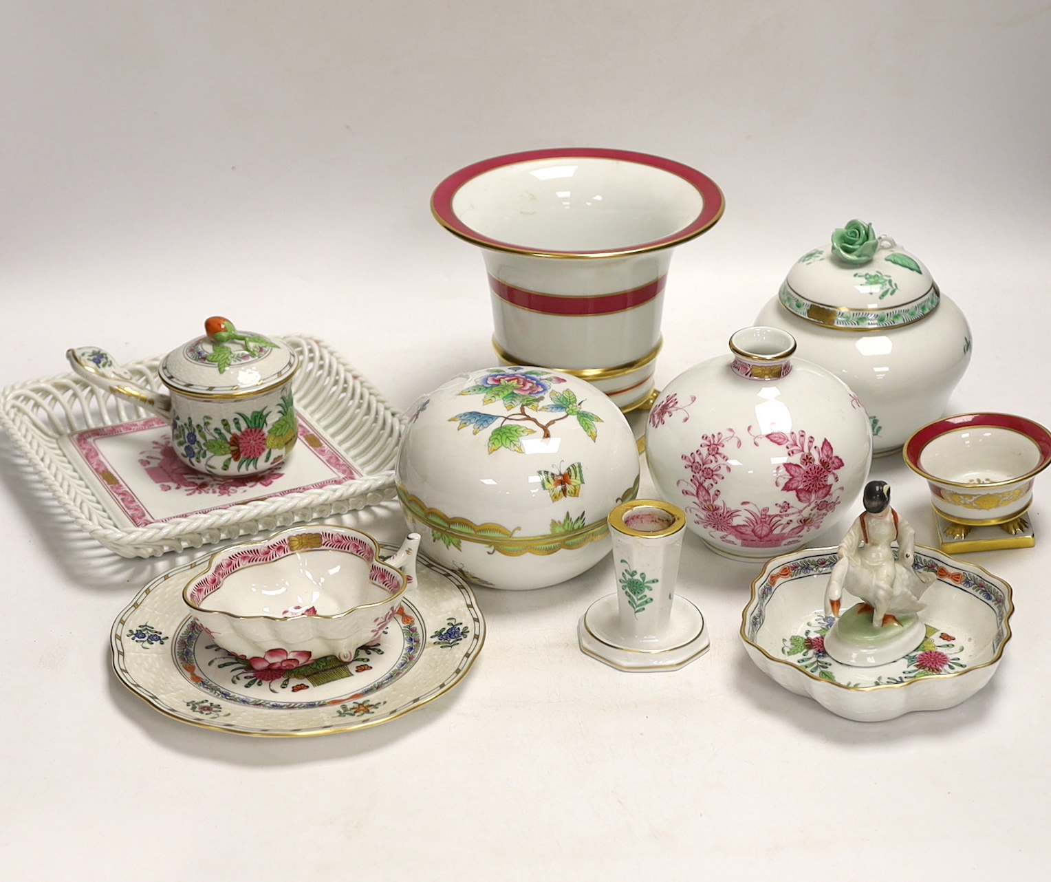 A group of Herend, Hungary porcelain wares including; a covered dish, tray, candlestick, two pedestal vases, boy on a goose, etc. tallest 13cm